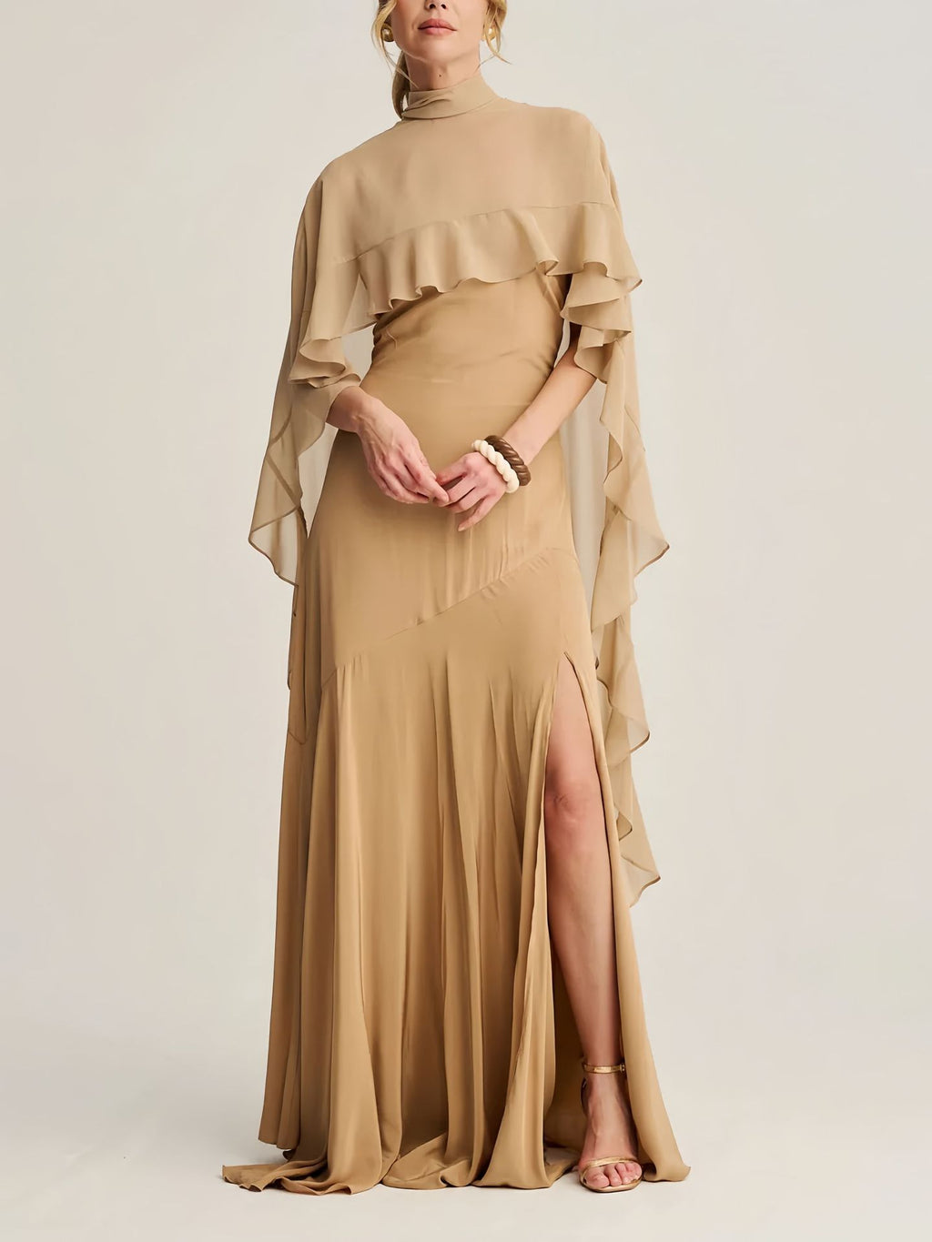 A long skirt with a turtleneck trimmed cape